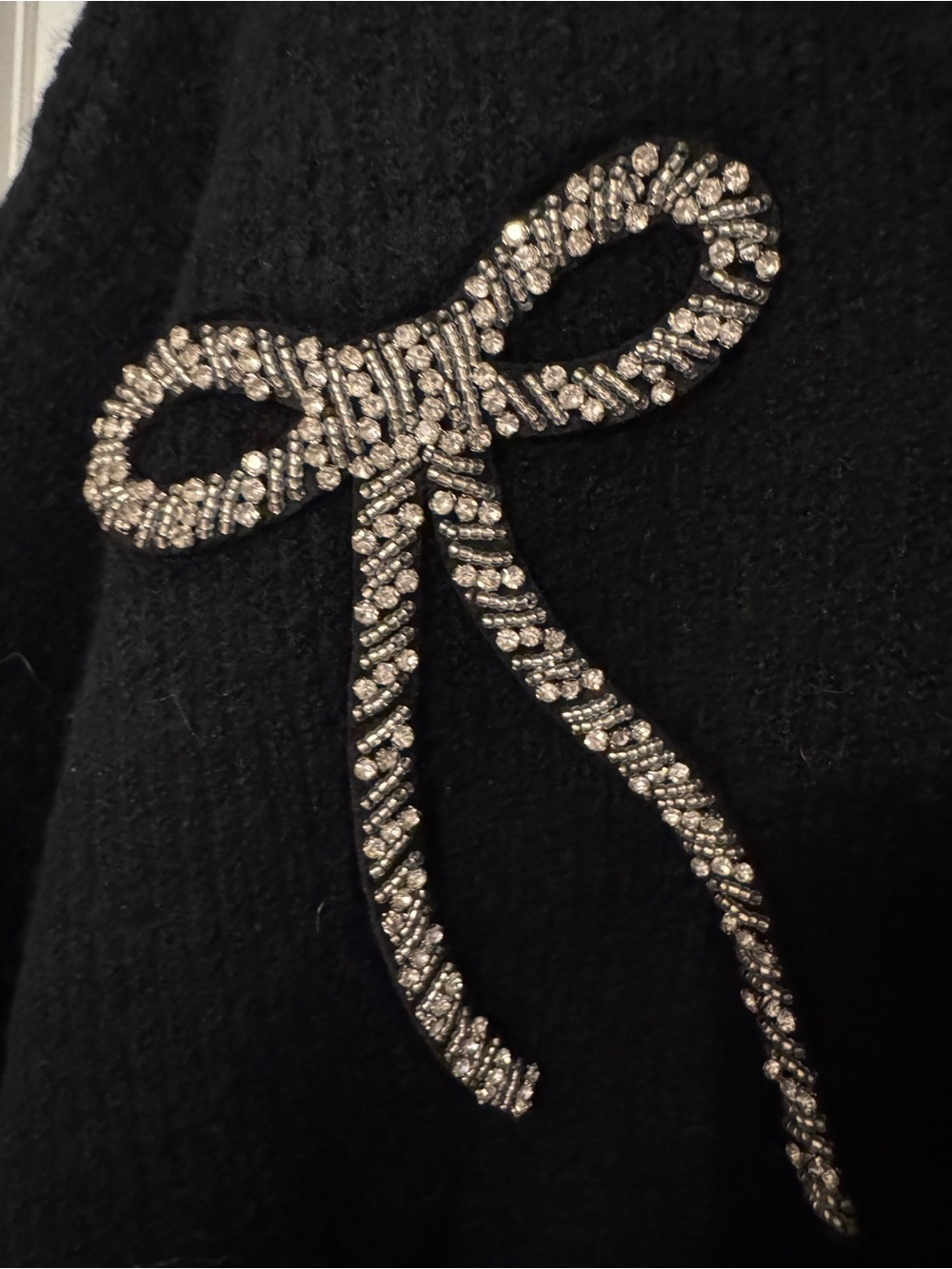 CeCe Black Crewneck Sweater with Crystal Bow Accent - Picture 2 of 5